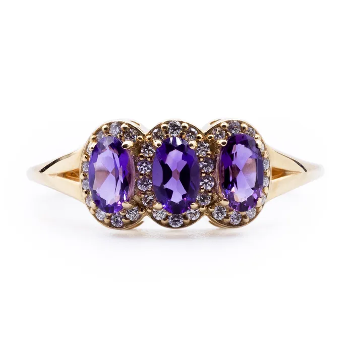 Oval Amethyst Three Stone Ring with Diamond Accented Halo on Split Shank Ring Fire Brilliance Rings Oval Amethyst Three Stone Ring with Diamond Accented Halo on Split Shank Ring Fire Brilliance Rings