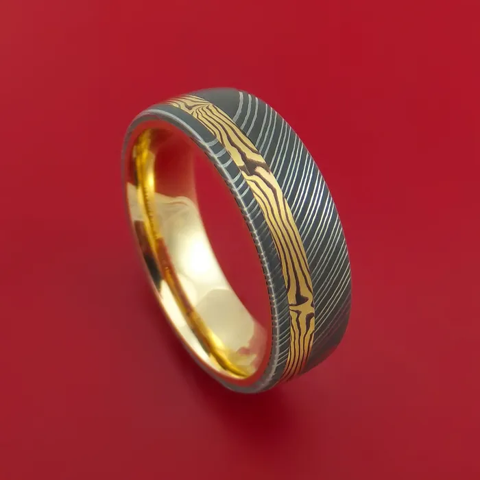 Rings Lashbrook Damascus Steel Ring with 18k Yellow Gold Mokume Shakudo Inlay and Interior 14k Yellow Gold Sleeve Custom Made Band Rings Lashbrook Damascus Steel Ring with 18k Yellow Gold Mokume Shakudo Inlay and Interior 14k Yellow Gold Sleeve Custom Made Band